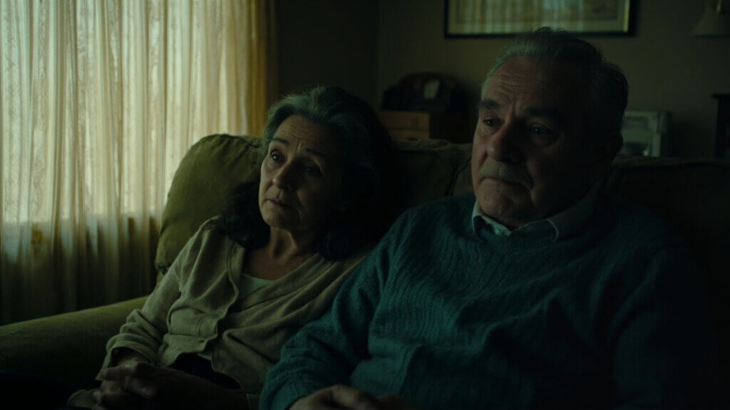Senior couple emotionally distant after a sensitive discussion, highlighting unspoken tension